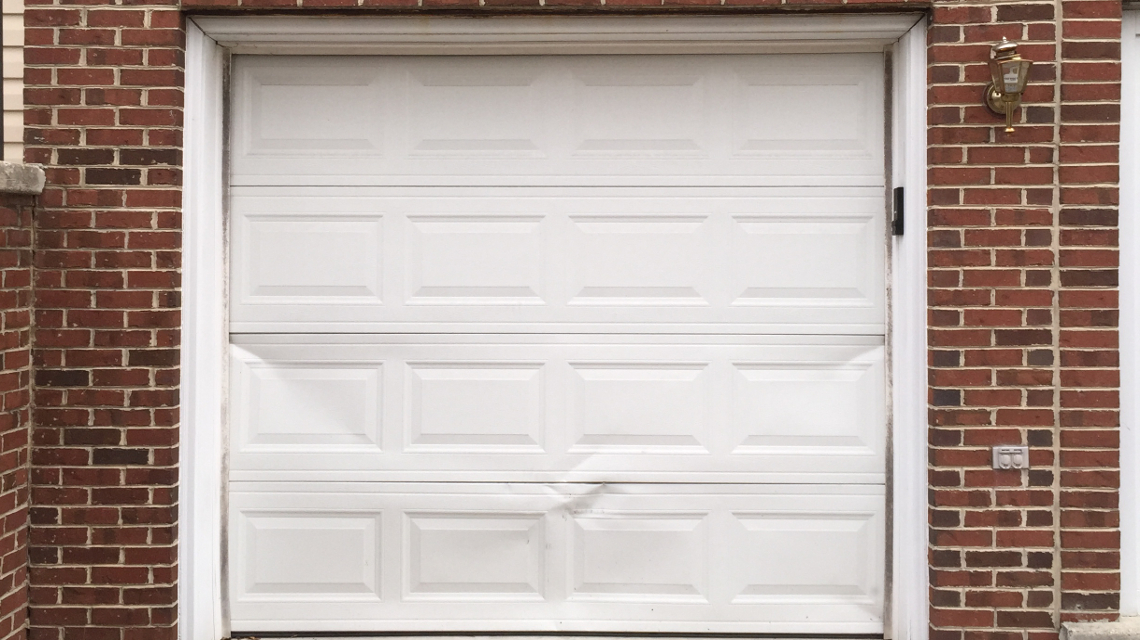 repair or replace dented garage door panel